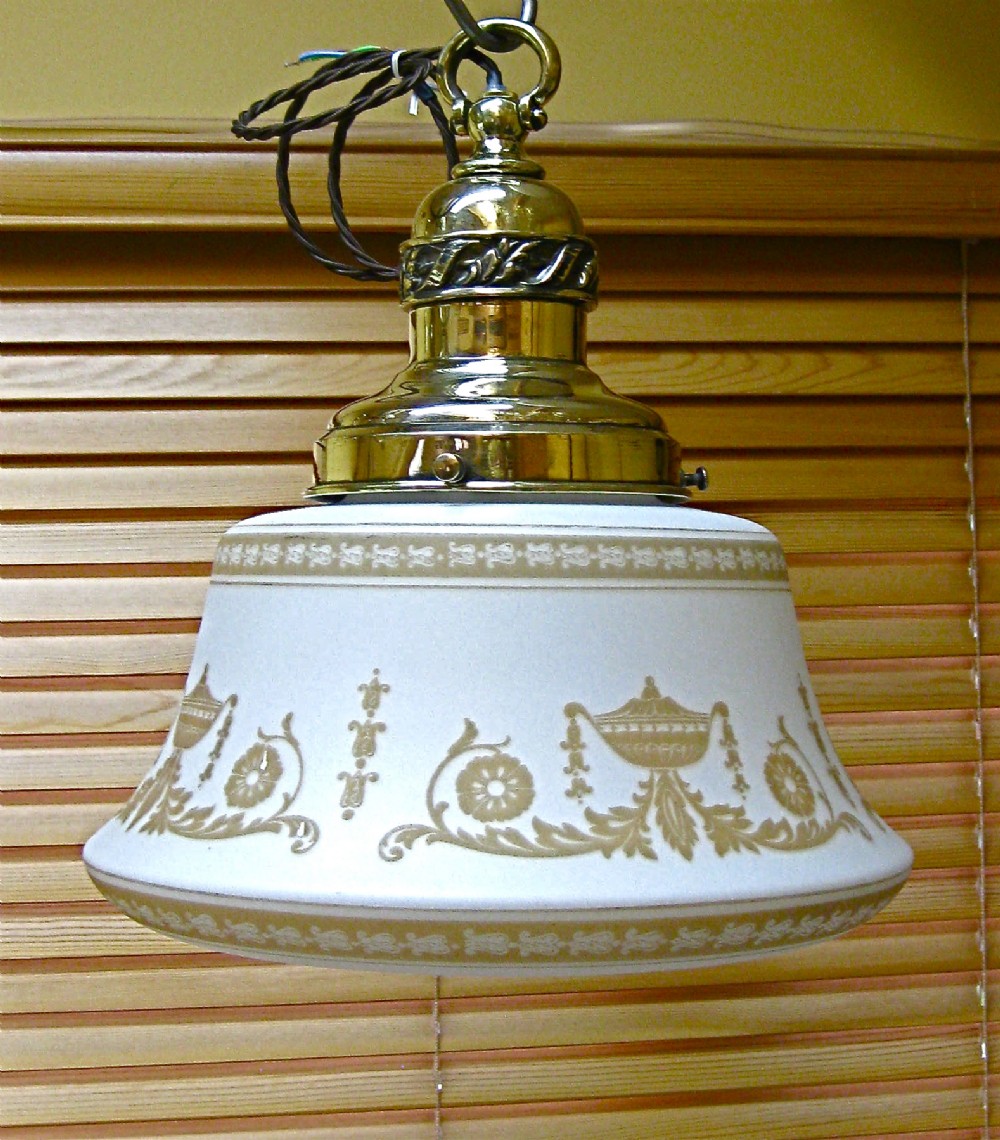A DECORATIVE GLASS CEILING LIGHT