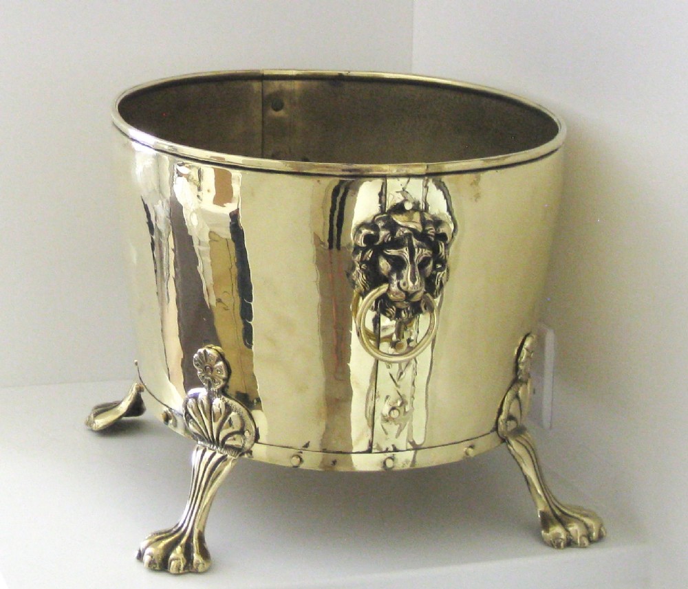 LARGE BRASS PLANTER WITH LION'S CLAW FEET