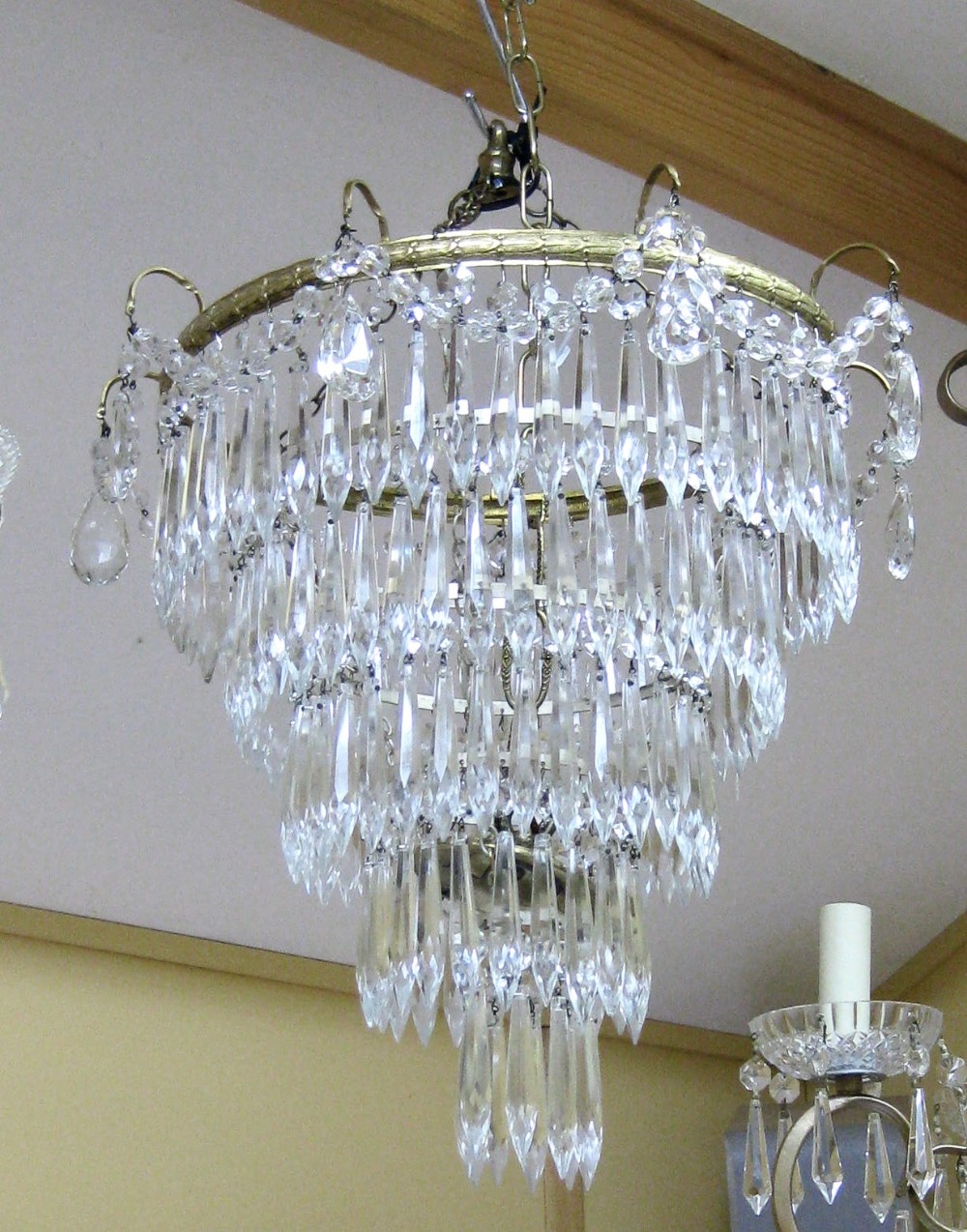 A FIVE TIER GLASS DROP CHANDELIER