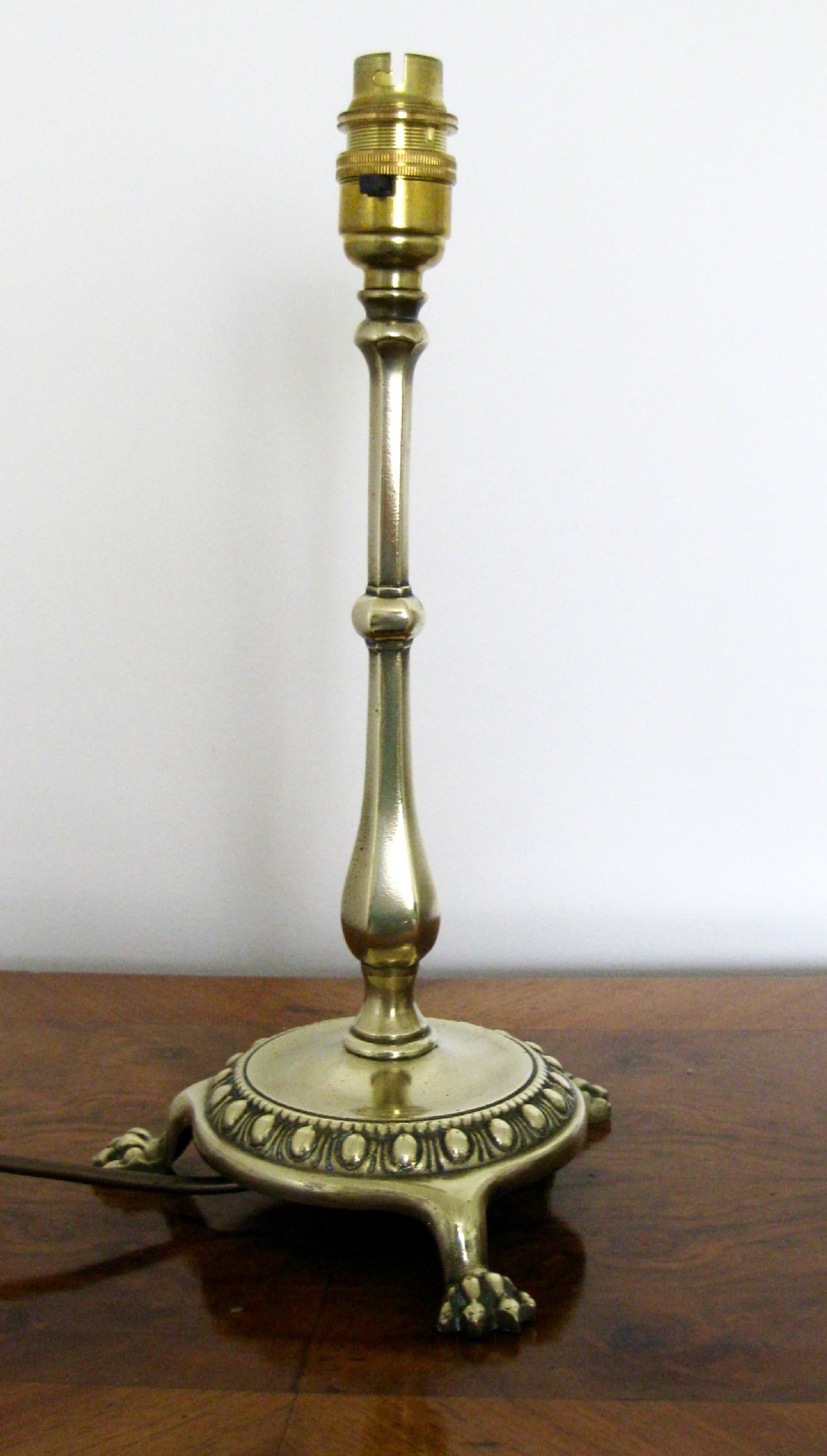 EDWARDIAN BRASS LAMP WITH LIONS CLAW FEET