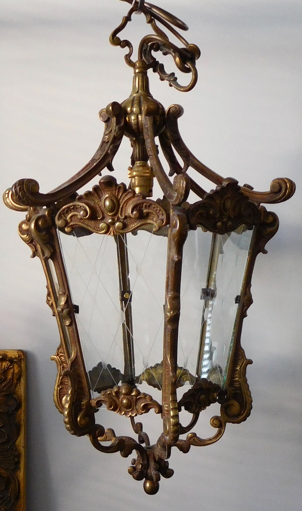 A HEAVY BRASS HALL LANTERN WITH SIX GLASS PANELS
