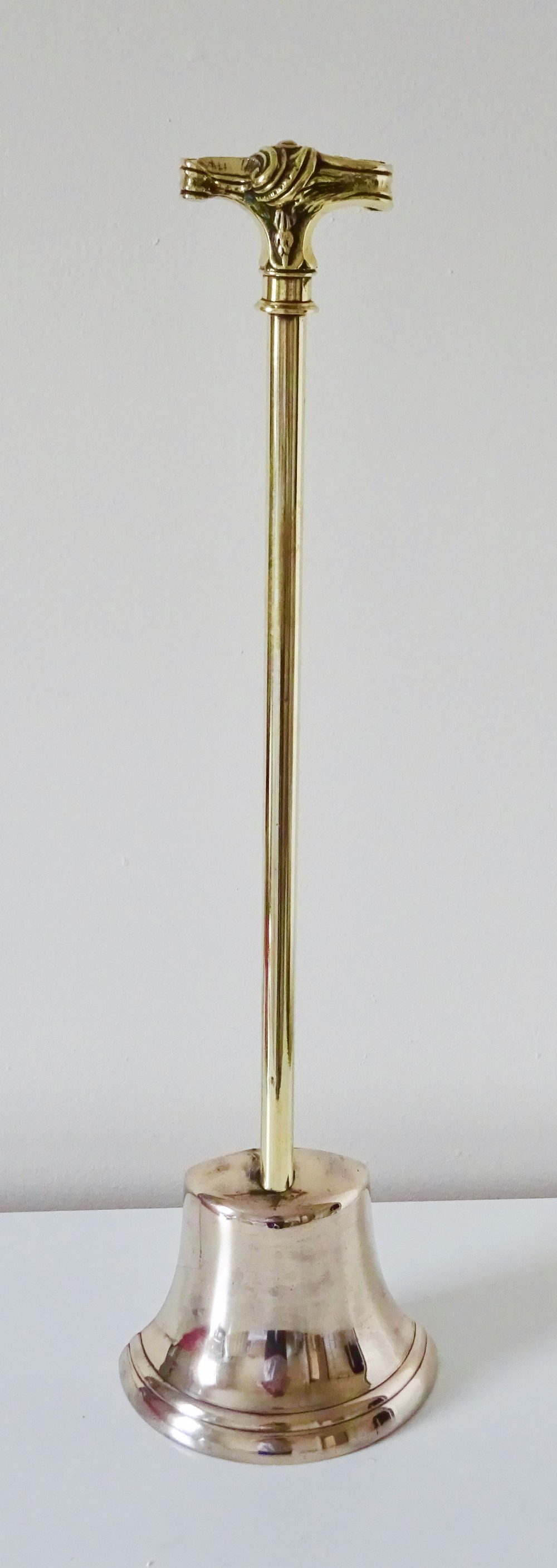 A VICTORIAN HALF BELL DOORSTOP