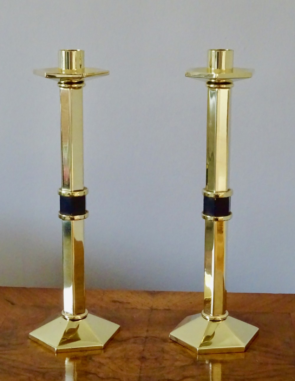 A PAIR OF HEAVY BRASS ART DECO CANDLESTICKS