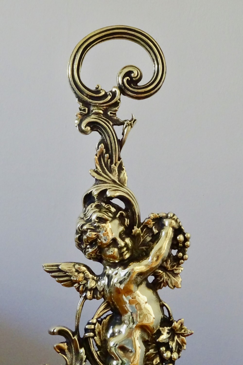 A VICTORIAN BRASS CHERUB DOOR STOP View IV