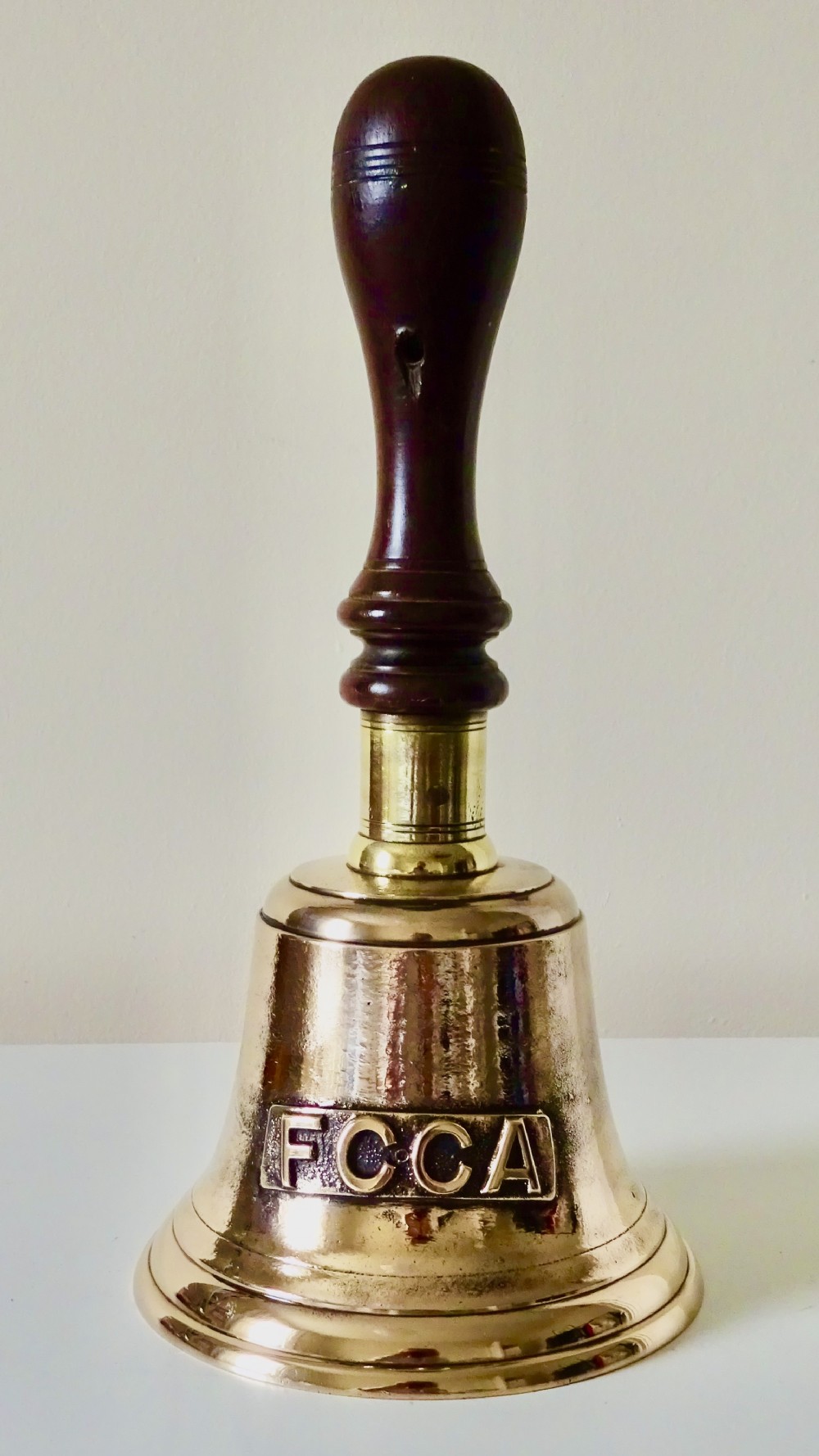 A LARGE RAILWAY HANDBELL WITH FCCA ON THE FRONT 