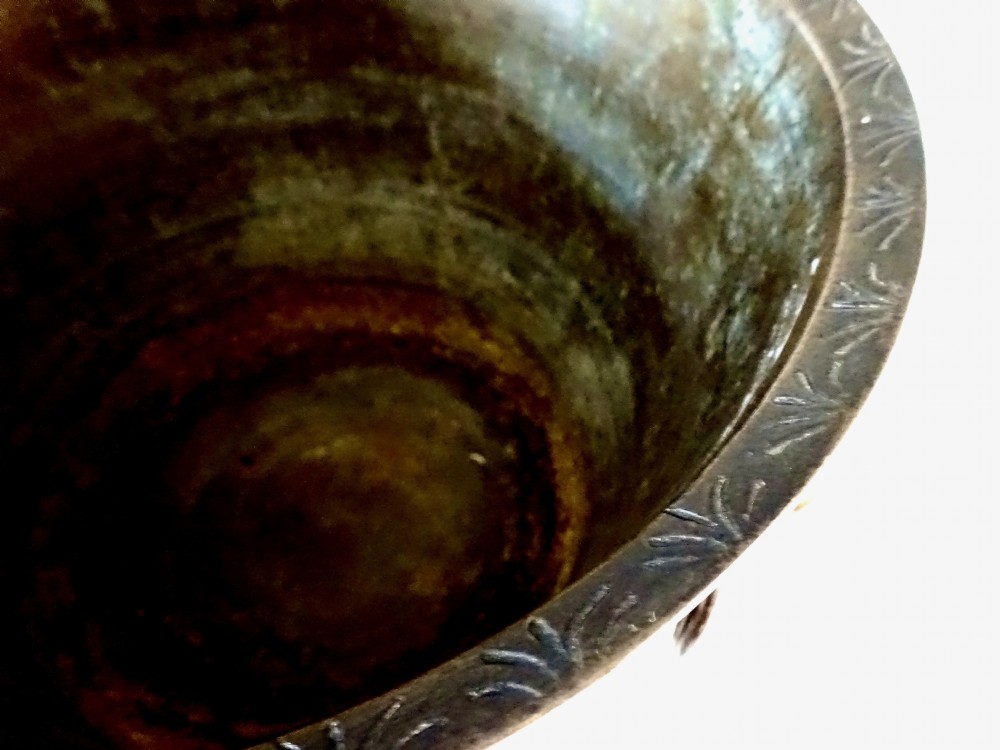 A deep flared dark bronze jardiniere featuring mask drop-ring handles and intricate engraved pattern band on a pedestal base. View VI