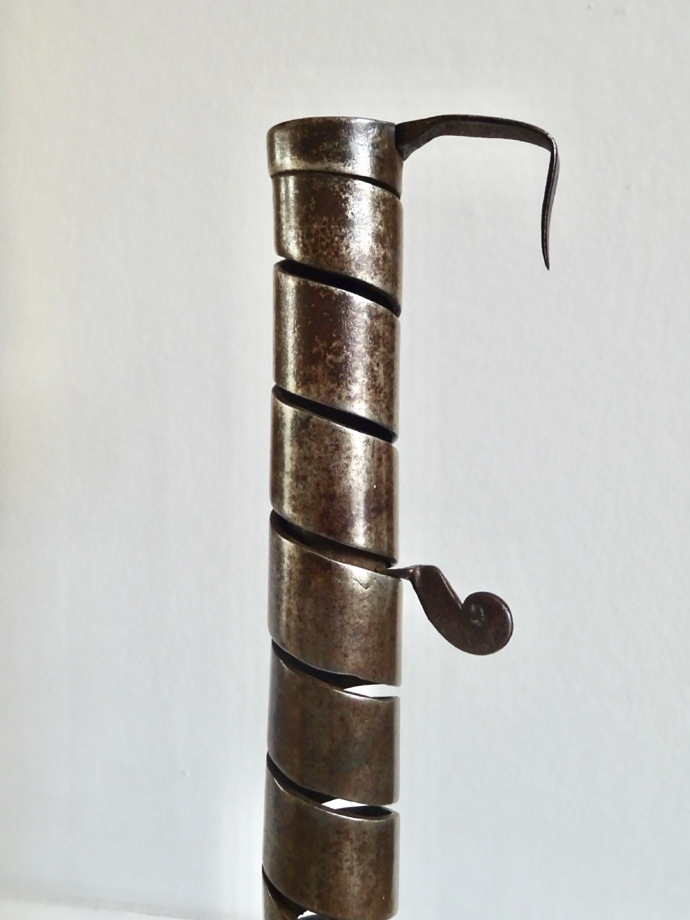 A 19th CENTURY IRON AND WOOD SPIRAL CANDLESTICK View II