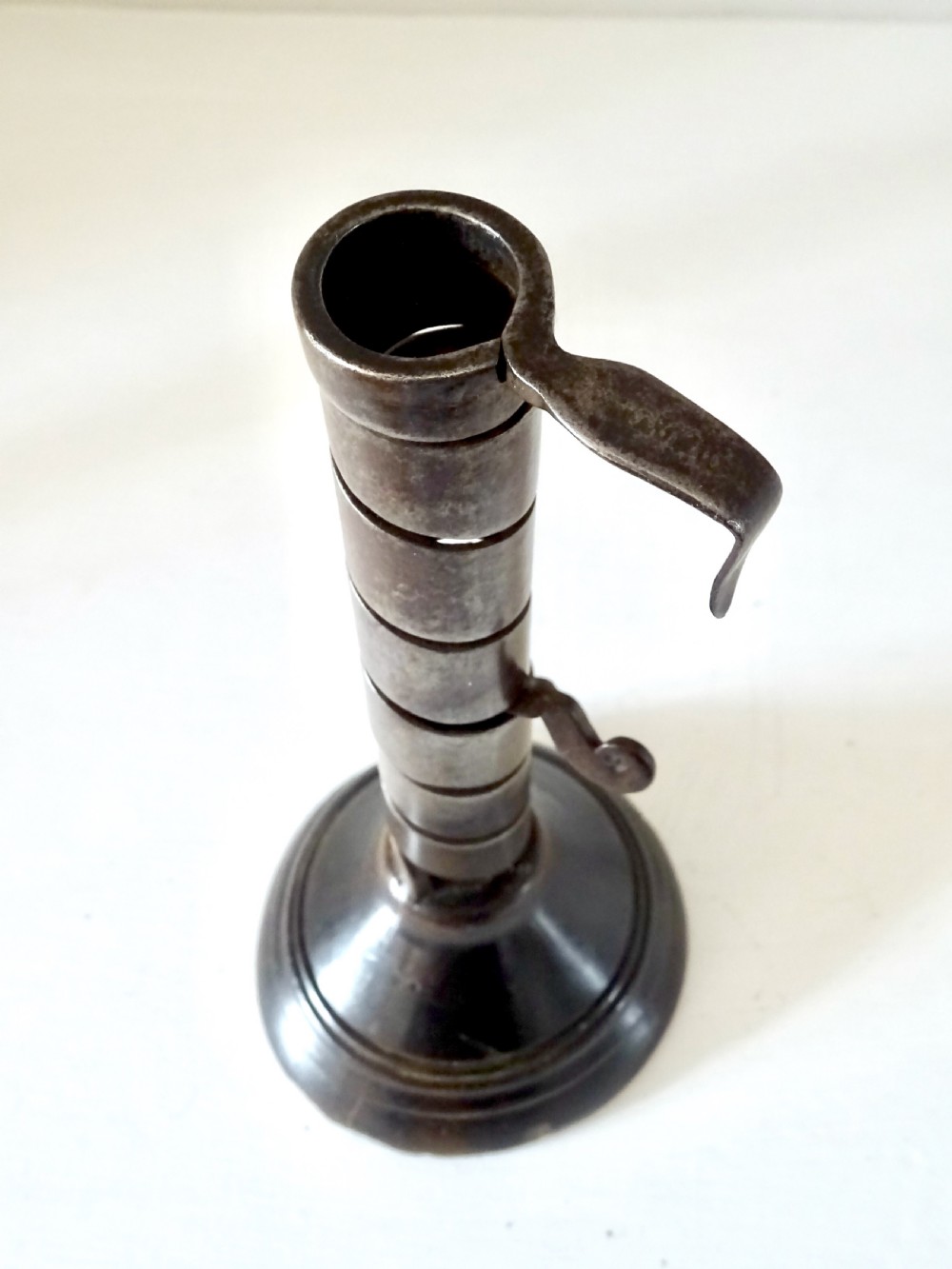 A 19th CENTURY IRON AND WOOD SPIRAL CANDLESTICK View III