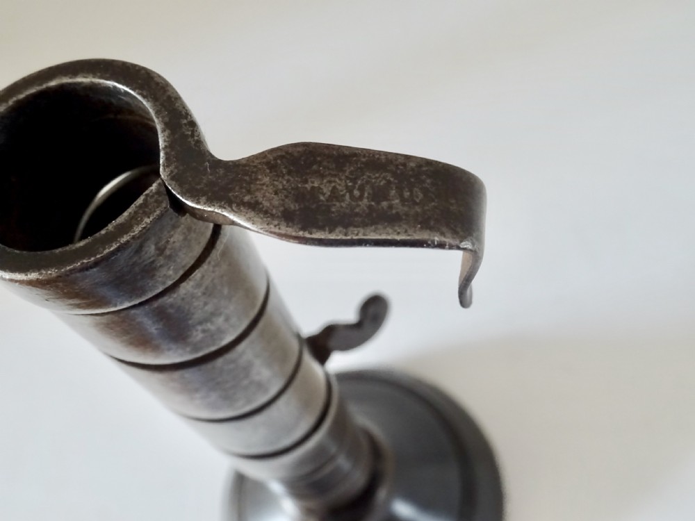 A 19th CENTURY IRON AND WOOD SPIRAL CANDLESTICK View VI