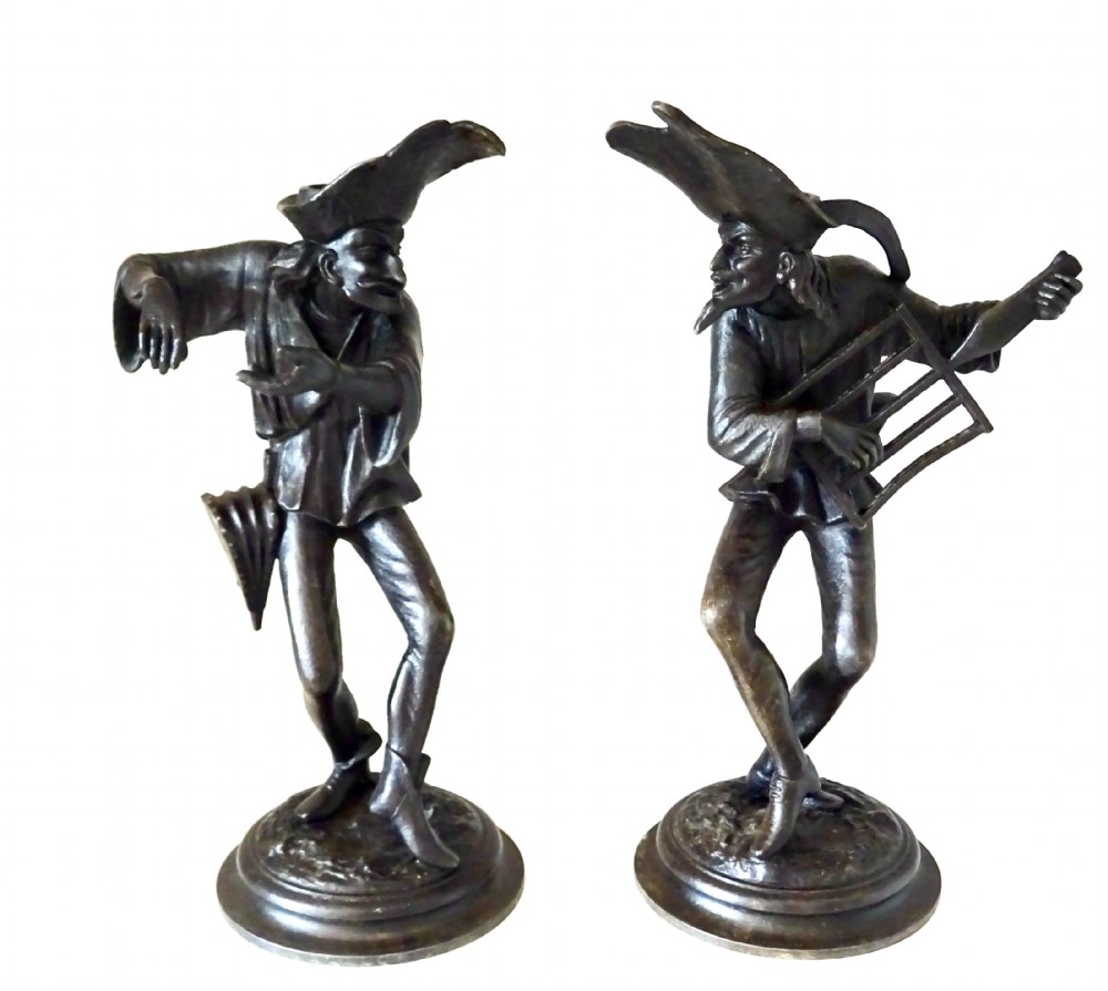 PAIR SPELTER GROTESQUE CANDLESTICKS