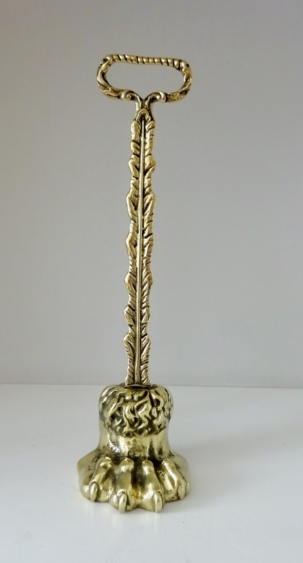 VICTORIAN BRASS LION'S FOOT DOORSTOP