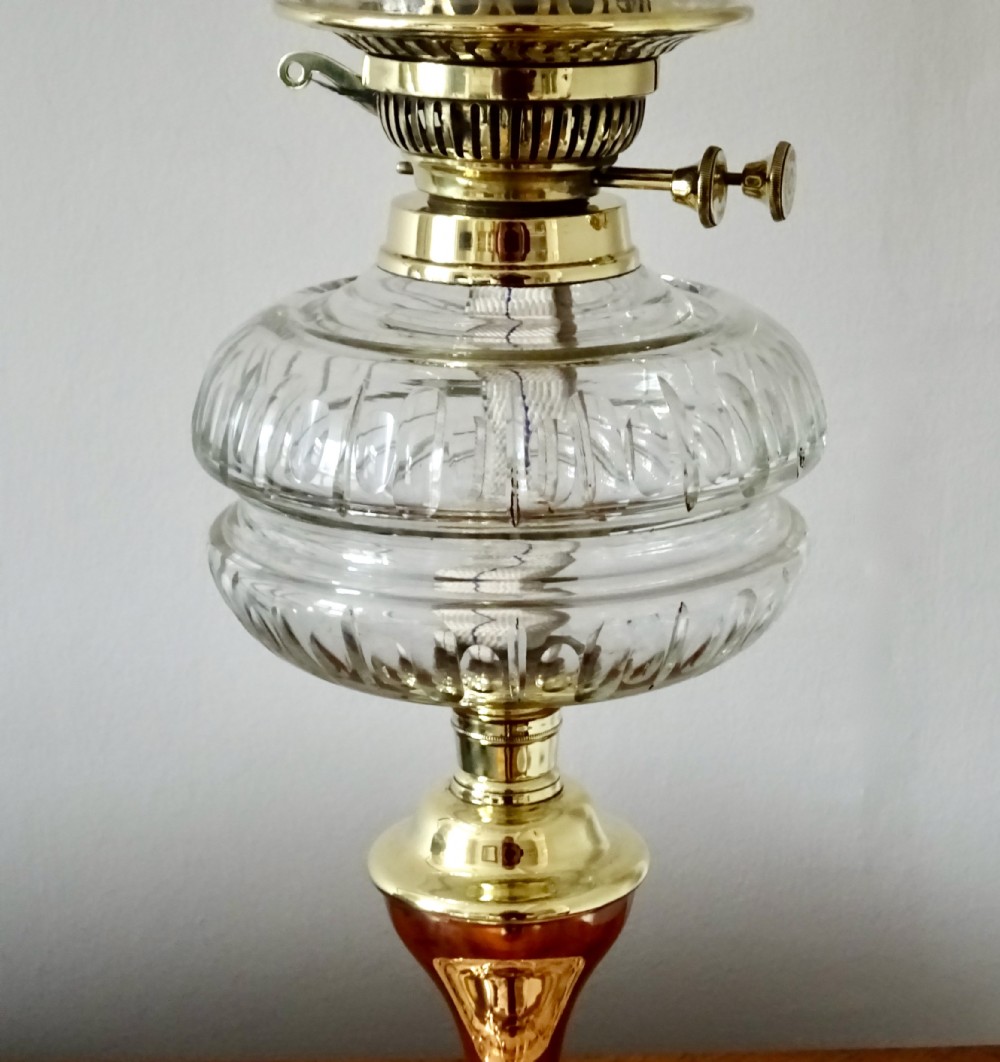 A BRASS, COPPER AND GLASS OIL LAMP View VI