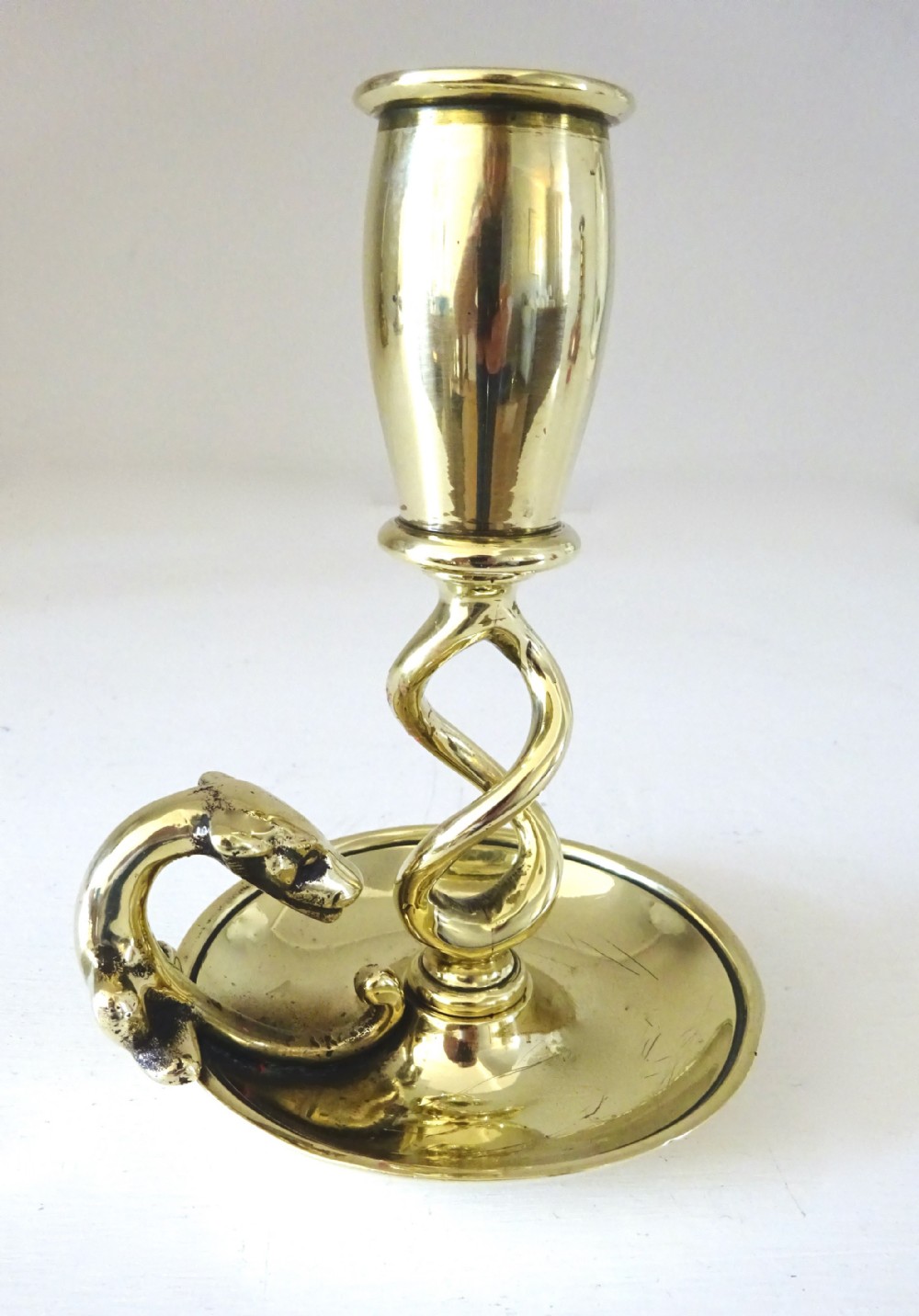 SMALL BRASS CANDLESTICK WITH A DOG