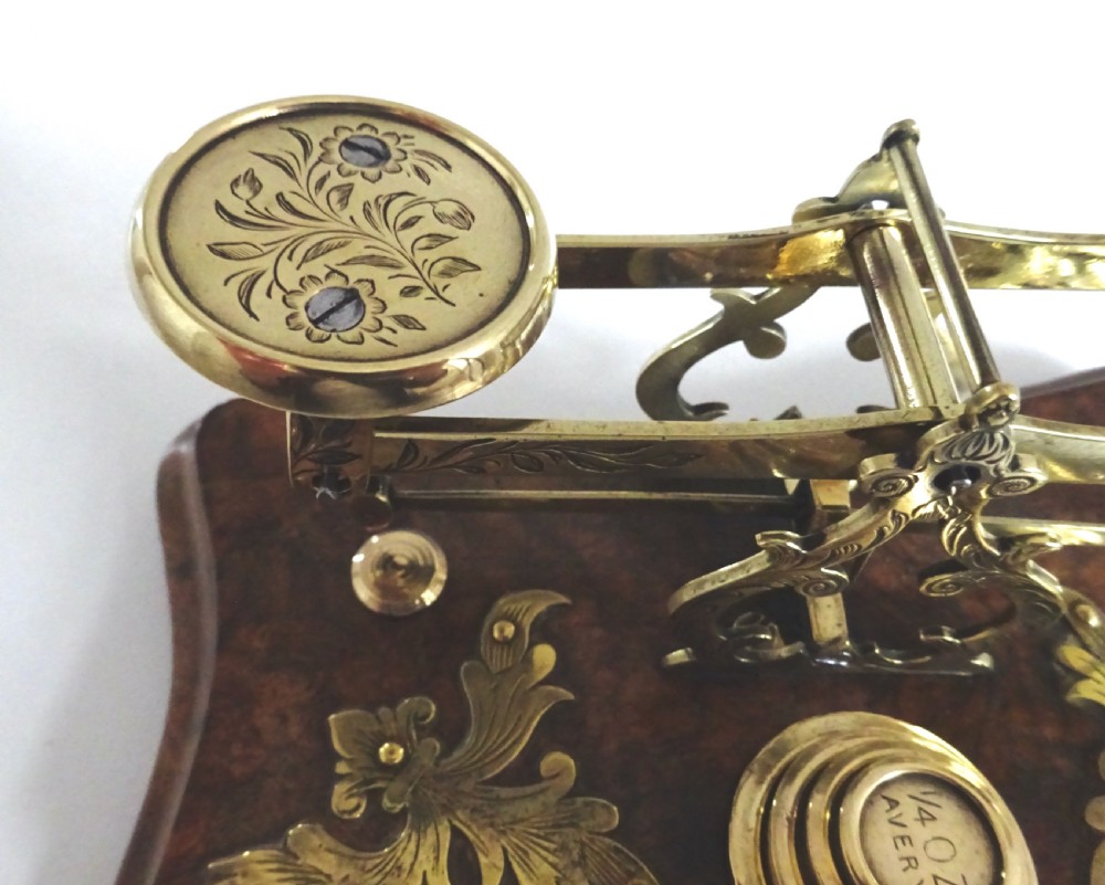 POSTAL SCALES ON A BRASS AND WALNUT BASE View VIII