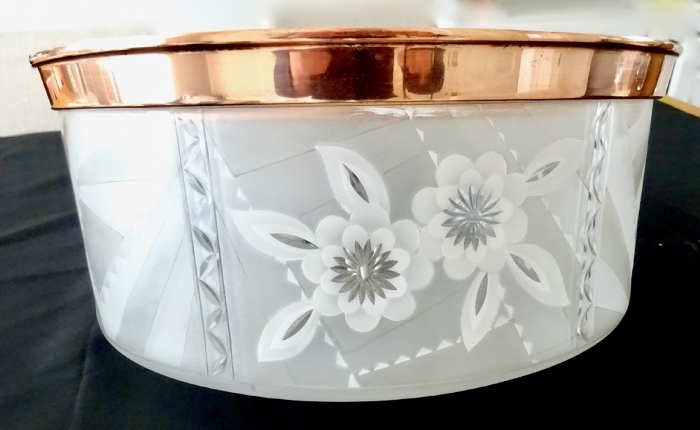 A circular 1930s flush mount ceiling light made of frosted glass featuring etched floral details and a polished copper gallery rim. View VI