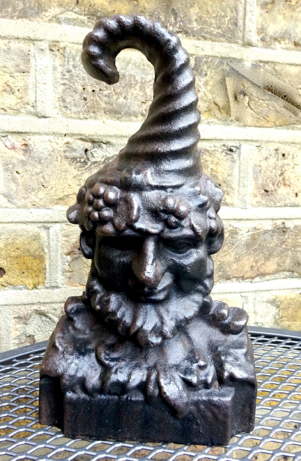 BACCHUS CAST IRON DOORSTOP