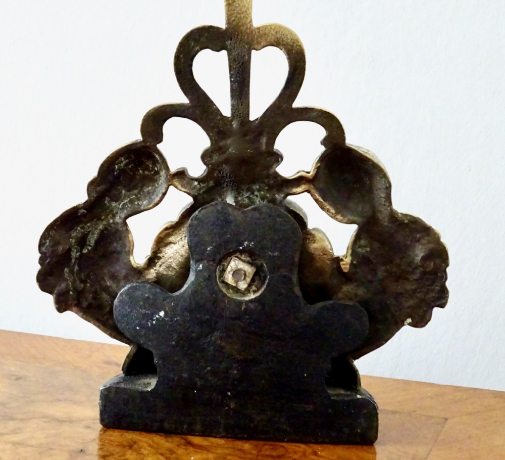 BRASS DOORSTOP WITH A SHELL AND CHERUBS View V