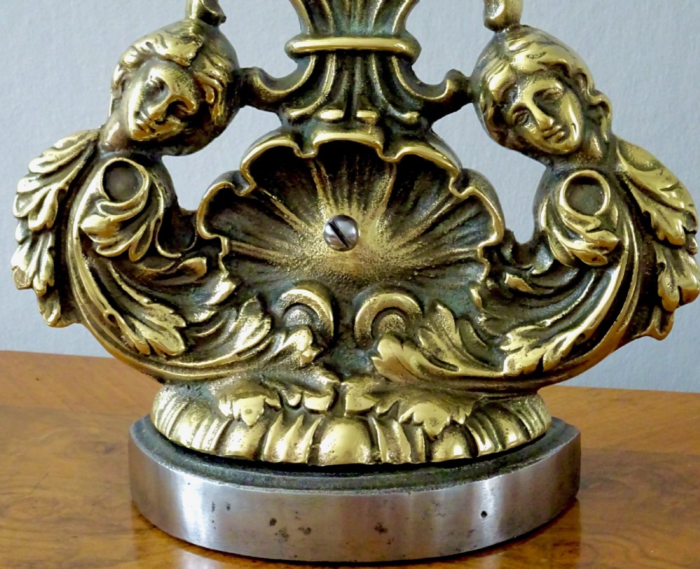 BRASS DOORSTOP WITH A SHELL AND CHERUBS View II