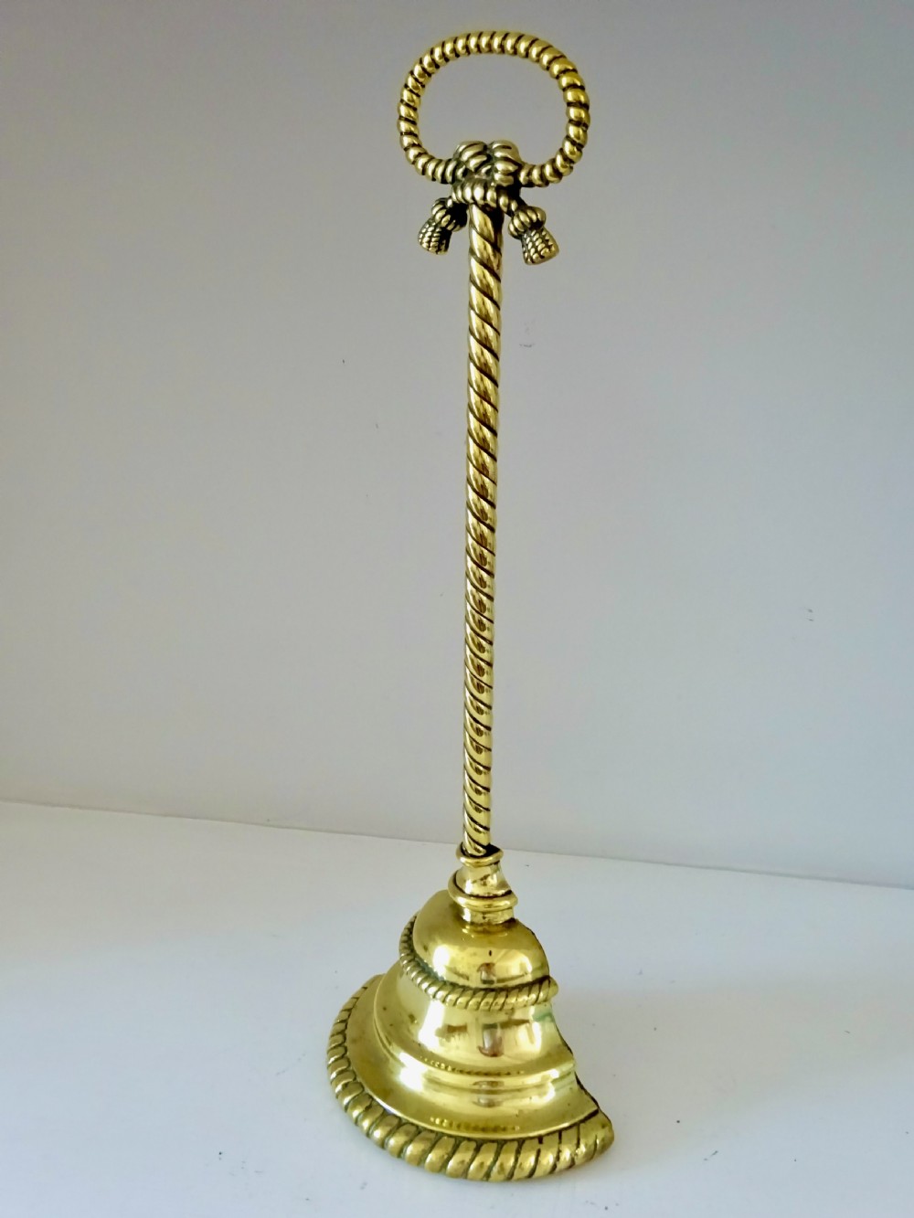 BRASS DOORSTOP WITH ORIGINAL IRON WEIGHTED BASE