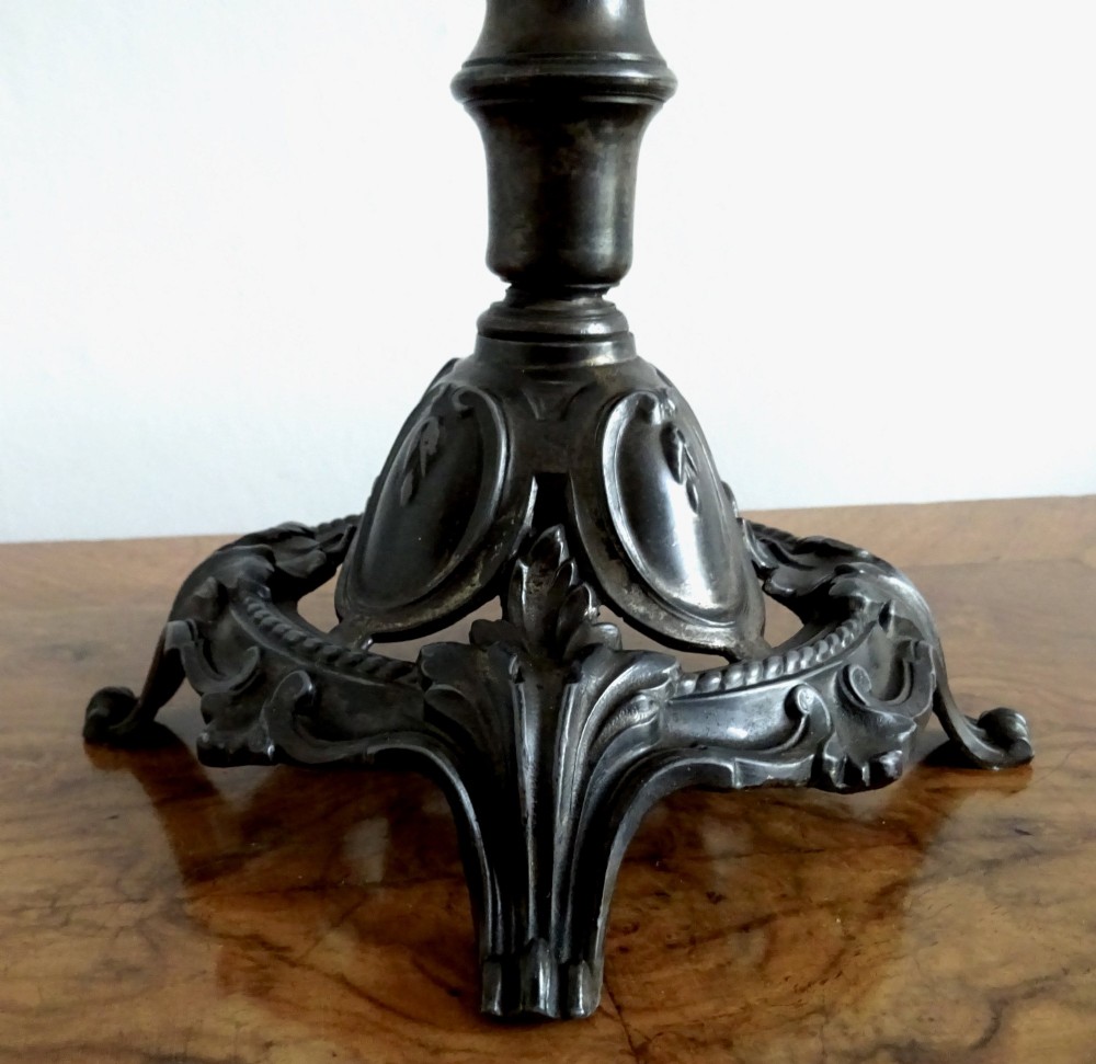 An antique single-trumpet epergne featuring a fluted clear glass vase fitted into an ornate dark cast-spelter base. View III