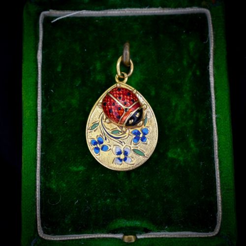 ANTIQUE ENAMEL LADYBIRD 15CT GOLD ENGRAVED OVAL PENDANT