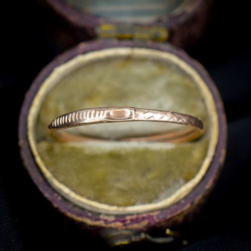 fig 2. A Georgian 9ct gold split ring with hand-engraved serpent Ouroboros details.