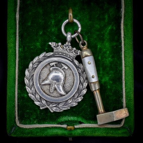 ART DECO '1931' SILVER FIREMAN MEDAL AND MOTHER OF PEARL HAMMER PENDANT