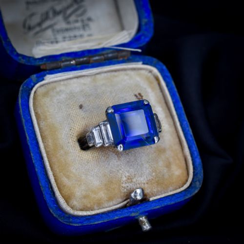 fig 1. An Art Deco sterling silver cocktail ring set with a large square-cut blue gemstone and stepped baguette-cut side stones.