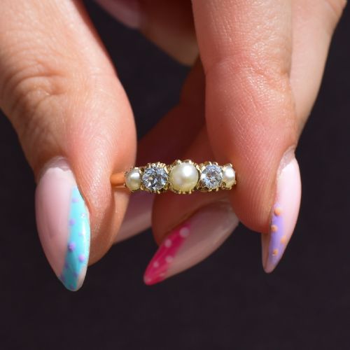 fig 1. An 18ct yellow gold Victorian five-stone ring featuring three round pearls alternating with two old-cut diamonds.