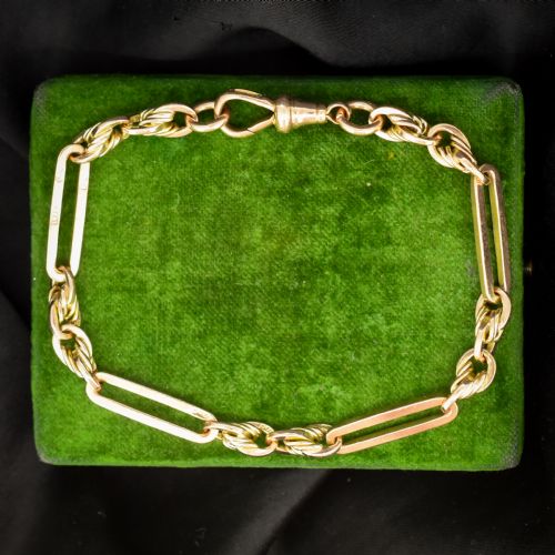 ANTIQUE CHESTER '1912' 9CT GOLD TROMBONE AND LOVE KNOT BRACELET WITH DOG CLIP 775