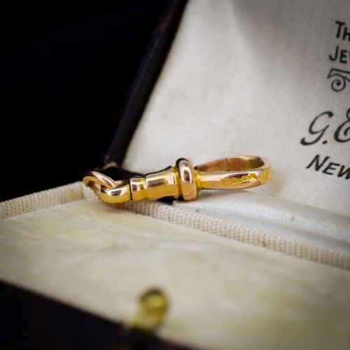 fig 1. An antique 15ct yellow gold dog clip swivel clasp resting inside a silk-lined presentation box.