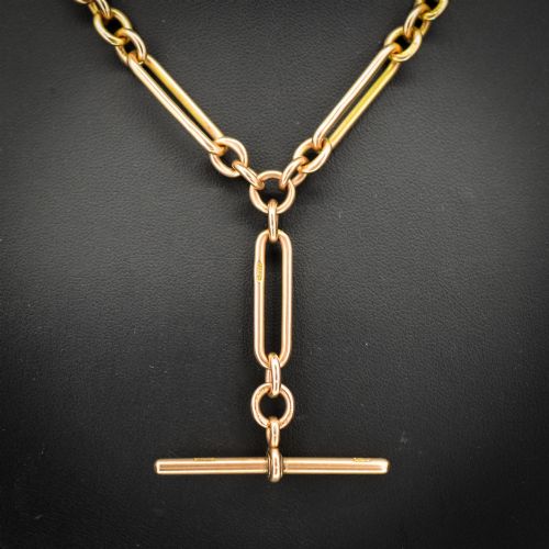 fig 1. A 9ct yellow gold Albert chain necklace featuring alternating trombone links and a central T-bar pendant drop.