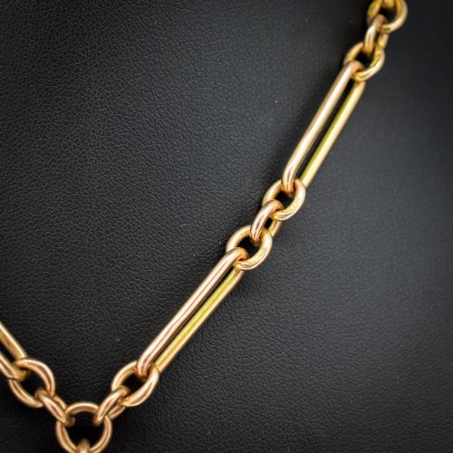 fig 2. A 9ct yellow gold Albert chain necklace featuring alternating trombone links and a central T-bar pendant drop.