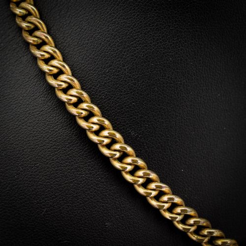 fig 3. An antique rolled gold curb link watch chain featuring a central T-bar dropper and double dog clip fasteners.