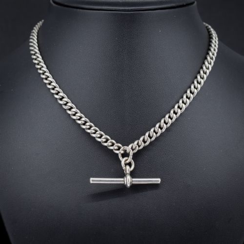 fig 1. An antique sterling silver uniform curb link Albert watch chain configured as a necklace with a suspended central T-bar.