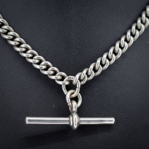 fig 2. An antique sterling silver uniform curb link Albert watch chain configured as a necklace with a suspended central T-bar.