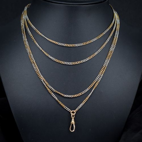fig 1. An antique multi-tone metal curb guard chain wrapped in multiple loops with an attached dog clip clasp.