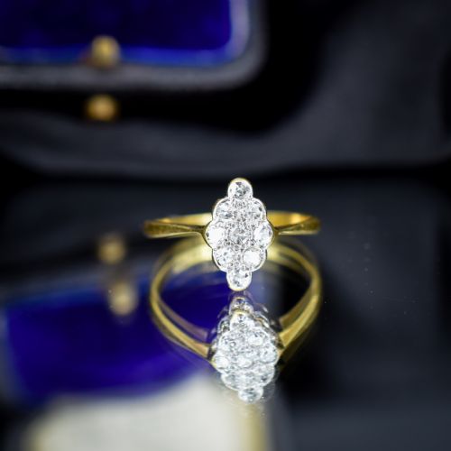fig 1. An antique diamond navette cluster ring set in platinum with an 18ct yellow gold band.