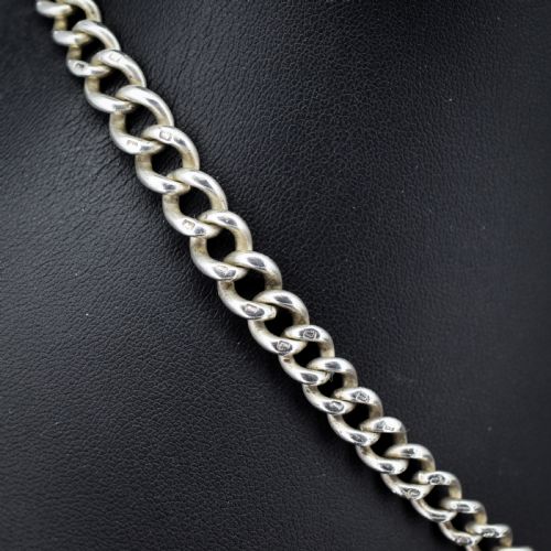 fig 1. An antique sterling silver curb link watch chain featuring a classic T-bar pendant.