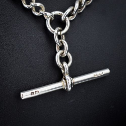 fig 2. An antique sterling silver curb link watch chain featuring a classic T-bar pendant.