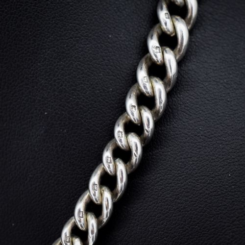 fig 3. An antique sterling silver curb link watch chain featuring a classic T-bar pendant.