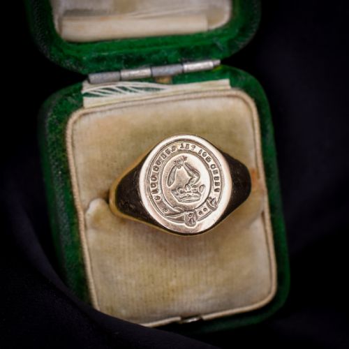 fig 2. A vintage 9ct yellow gold signet ring featuring an oval bezel hand-engraved with a crest intaglio design.