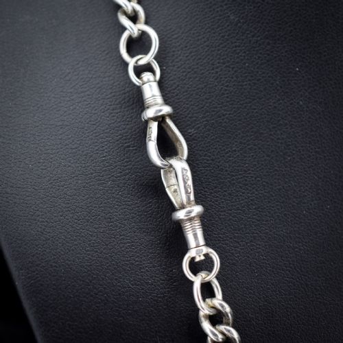 fig 2. A sterling silver uniform curb link necklace with a T-bar pendant and dog clip clasp displayed on a black neck bust.