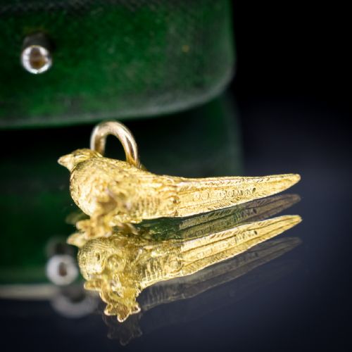 fig 1. A detailed three-dimensional 9ct yellow gold pheasant bird charm with textured feathers and an attached jump ring.