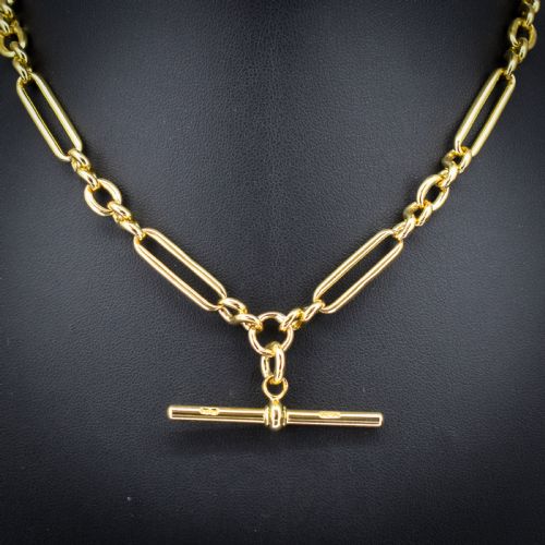 fig 2. An antique 18ct yellow gold trombone link watch chain featuring an integrated T-bar and swivel clasp fastener.