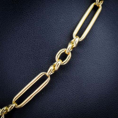 fig 3. An antique 18ct yellow gold trombone link watch chain featuring an integrated T-bar and swivel clasp fastener.