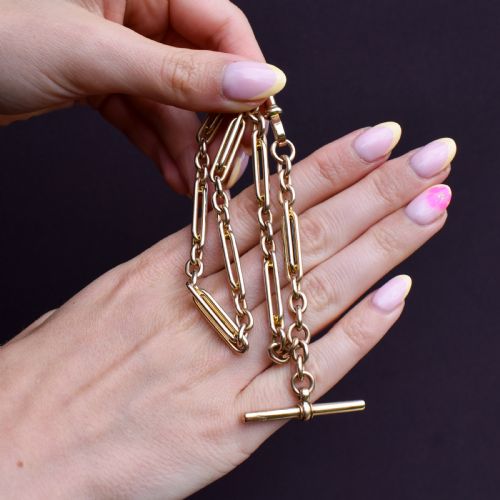 fig 2. A 10ct yellow gold Albert chain with alternating trombone and oval links, complete with a T-bar and swivel clasp.