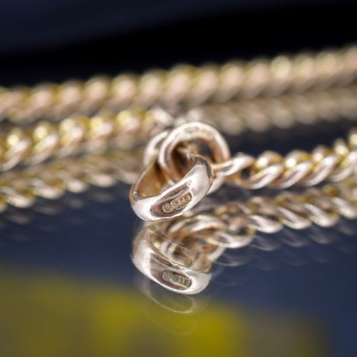 fig 2. An antique 9ct yellow gold curb link chain bracelet fitted with a dog clip swivel clasp.