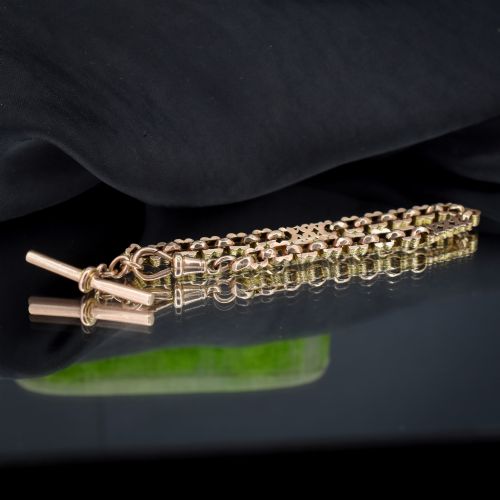 fig 1. An antique 9ct yellow gold fancy link chain bracelet with a swivel clasp and suspended T-bar element.