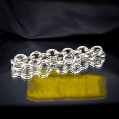 fig 1. A sterling silver link bracelet composed of interlocking oval cable links with a bolt ring clasp.